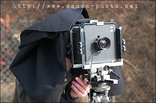 mise au point sous la cape du photographe
